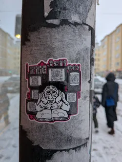 Street sticker The sticker depicts a central, disheveled character with large eyes and messy hair, holding their hands to their ears as if overwhelmed. They are seated, seemingly engrossed in an open book that displays chemical structures. Surrounding the figure is a chaotic stack of old-fashioned television sets, each screen featuring a QR code with an Instagram logo at its center. The artwork is primarily black and white, with a striking pink outline around the entire sticker and subtle pink accents within the text at the top. The style is cartoonish and somewhat gritty.