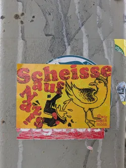 Street sticker The sticker has a striking yellow to orange gradient background. Large, distressed red text dominates the left side, reading 'Scheisse Sauf auf'. On the right, a black outline illustration of a bird, possibly a seagull, is depicted wearing a striped beanie. The bird appears to be vomiting or expelling black liquid and red specks. In the bottom right corner, smaller red text reads '@wir sagen moin'. The overall aesthetic is gritty and cartoonish, combining strong text with a peculiar illustration.