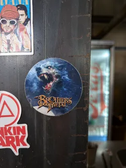 Street sticker Circular sticker showing a snarling blue werewolf with glowing eyes and sharp fangs. The band name 'Brothers of Metal' is written in a stylized gold font at the bottom.