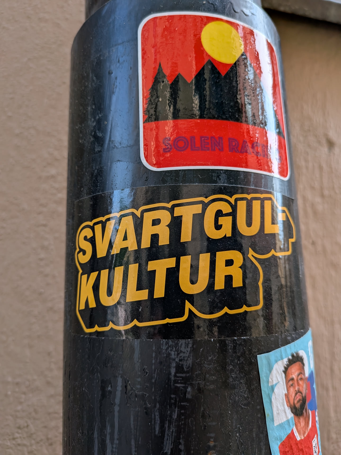 A die-cut sticker featuring the Swedish text 'SVARTGUL KULTUR' in bold yellow font on a black background with a yellow outline.