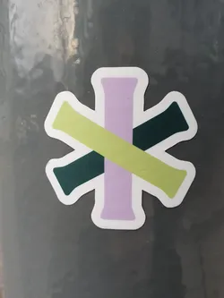 Street sticker Close-up view of a sticker featuring an abstract design. The sticker consists of four rectangular shapes in pale purple, light green, and dark green, arranged to form a cross-like pattern. The shapes overlap and intersect, creating a visually interesting composition. The sticker has a white border.
