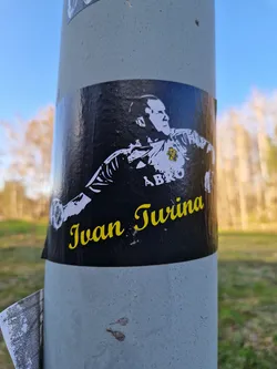 Street sticker A black and white sticker featuring Ivan Turina, a Croatian football goalkeeper.  The sticker has a dark background with the image of Turina in a goalkeeping pose. His name is written in yellow lettering at the bottom.