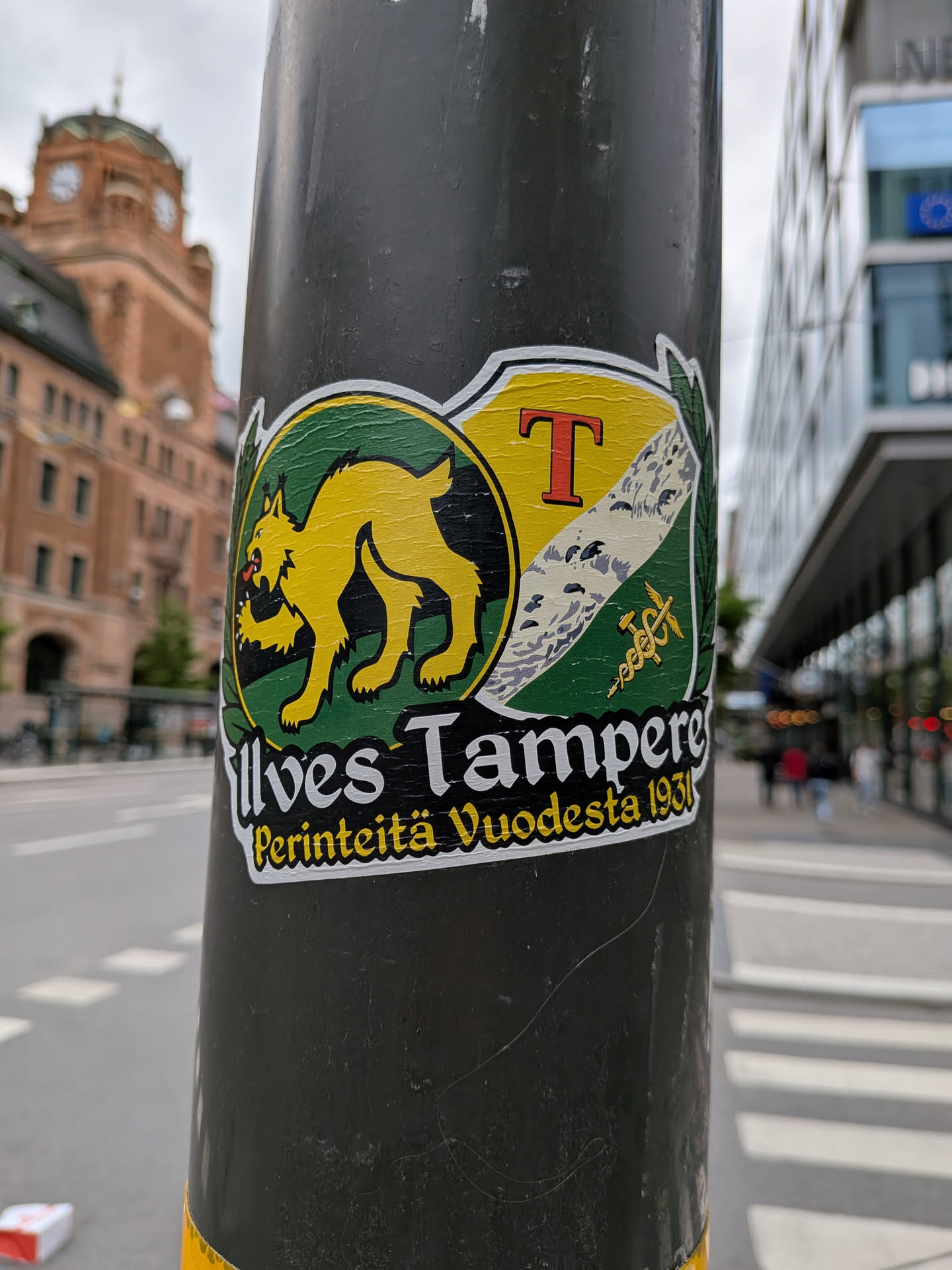 A die-cut sticker featuring the yellow Ilves lynx logo on a green circle, paired with the Tampere coat of arms shield. Text below reads 'Ilves Tampere' and 'Perinteitä Vuodesta 1931' on a black background.