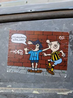 Street sticker The sticker depicts two cartoon characters in front of a brick wall background. The character on the left wears a blue and black striped jersey, blue shorts, and a dark blue cap. They are on roller skates and have a speech bubble above their head. The character on the right wears a yellow and black striped jersey, blue shorts, and is also on roller skates. This character appears to be reacting to the other, with one hand covering their face. There is stylized graffiti on the brick wall and a small artist signature in the upper right corner. The bottom of the sticker shows a tiled sidewalk.