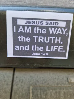 A religious sticker with a bible quote from John 14:6. The sticker has a dark gray background with white text.