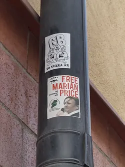 A sticker featuring a picture of Marian Price with the text "Free Marian Price" and other related text.  There's another sticker above it with cartoon characters and the text "GB 10 svåra år".