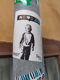 Black and white stencil sticker of a child screaming.  Social media icons are at the top. The artist's signature is visible at the bottom right. 