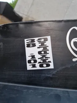 Street sticker Black and white sticker with the text "30 OHIO 101" vertically stacked. The sticker is affixed to a dark-colored surface.