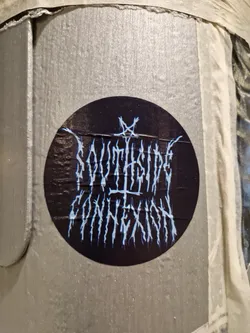 Round black sticker with the text "Southside Connexion" written in a stylized, black metal-inspired font.  A small inverted pentagram is visible above the text.