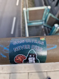 Street sticker A green sticker with a hooded figure and a vintage football. The text 'GAIS Ultras Never Dies' is prominently displayed.