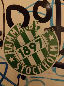 Street sticker A round sticker featuring the logo of Hammarby IF, a Swedish football club founded in 1897. The logo is predominantly green and white, with the club's name and founding year prominently displayed.