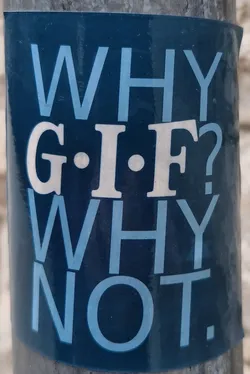 Street sticker A dark-blue sticker with a question and answer about GIF. The text is written in a sans-serif typeface with a light-blue color.