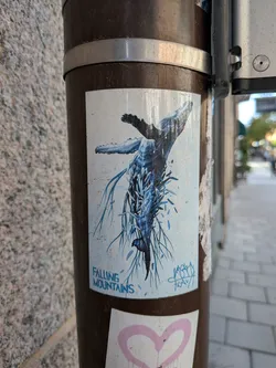 Street sticker Rectangular sticker depicting a humpback whale diving downwards, its body shattering into blue crystalline shards and root-like tendrils against a pale background with faint snowflake patterns.