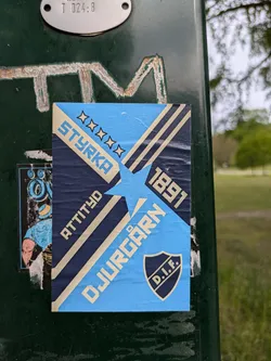 Street sticker This sticker features the logo of Djurgården IF, a sports club based in Stockholm, Sweden. It has a retro design with the text "STYRKA," "ATTITYD," and "DJURGÅRDEN" along with the year "1891".