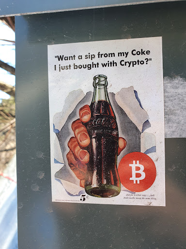 Street sticker &quot;Want a sip from my Coke I just bought with Crypto?&quot;