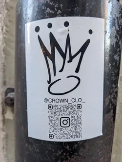 A white sticker with a black crown design and the text "@CROWN_CLO_".  It also includes a QR code linking to an Instagram account.