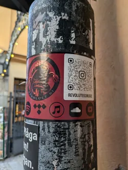 Street sticker Sticker featuring a scorpion design and links to various music platforms. QR code links to Instagram.