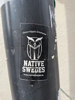 Street sticker A rectangular black sticker featuring a white line-art illustration of an owl wearing glasses and a vest. It includes the text 'Street Hippie Streetwear' at the top, 'NATIVE SWEDES' in a bold block font, and the website 'www.nativeswedes.se' at the bottom.