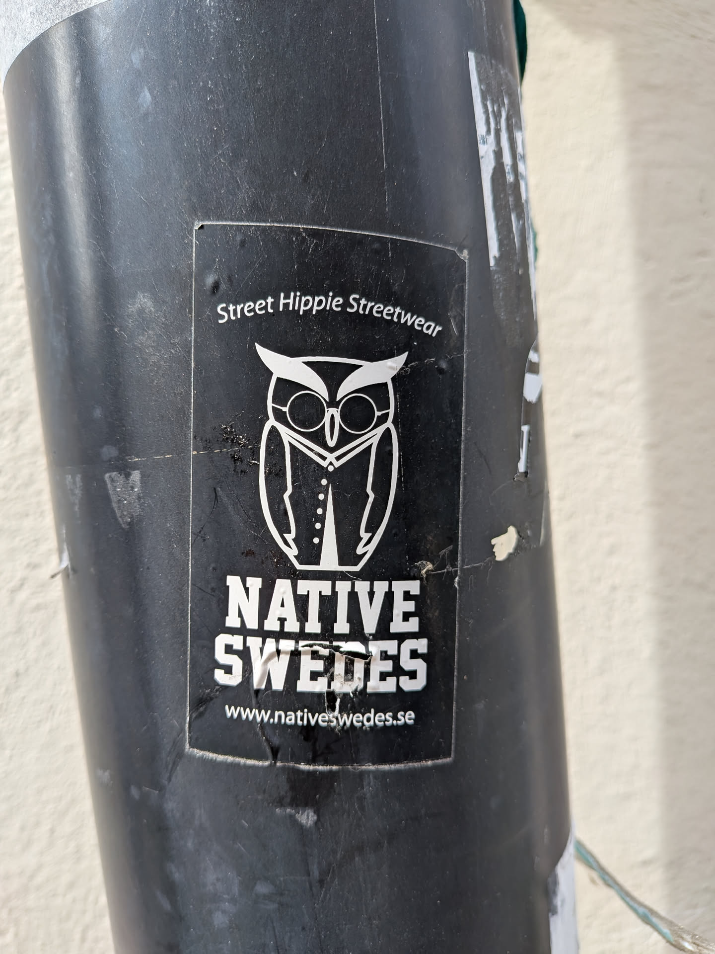 A rectangular black sticker featuring a white line-art illustration of an owl wearing glasses and a vest. It includes the text 'Street Hippie Streetwear' at the top, 'NATIVE SWEDES' in a bold block font, and the website 'www.nativeswedes.se' at the bottom.