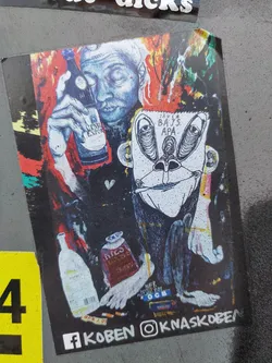 Street sticker This sticker displays vibrant, psychedelic artwork. The main focus is a man with a contemplative expression, holding what looks like a dark-colored bottle. Beside him sits a whimsical, almost grotesque creature resembling a monkey with exaggerated features. The overall style is gritty and expressive, with a chaotic yet deliberate arrangement of elements. The color palette is bold, using contrasting shades of red, blue, and black. There are additional items depicted, including cigarettes and what appears to be a milk carton, suggesting a narrative about indulgence and perhaps contemplation. The text "JAVLA BAJS APA" is visible, which may be a title or part of the artwork's message. The artist's social media links for Facebook and Instagram are also present at the bottom.