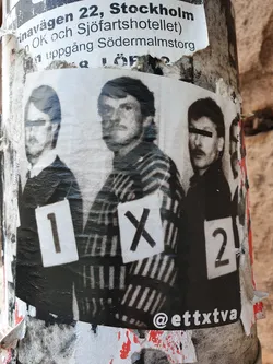 Street sticker A sticker featuring a black and white photograph of three men, each with a number (1, X, 2) visible on their chest. The photo's style suggests a police lineup or a similar context. The sticker is attached to a weathered surface.  The Instagram handle @etttxtva is visible in the bottom right corner.