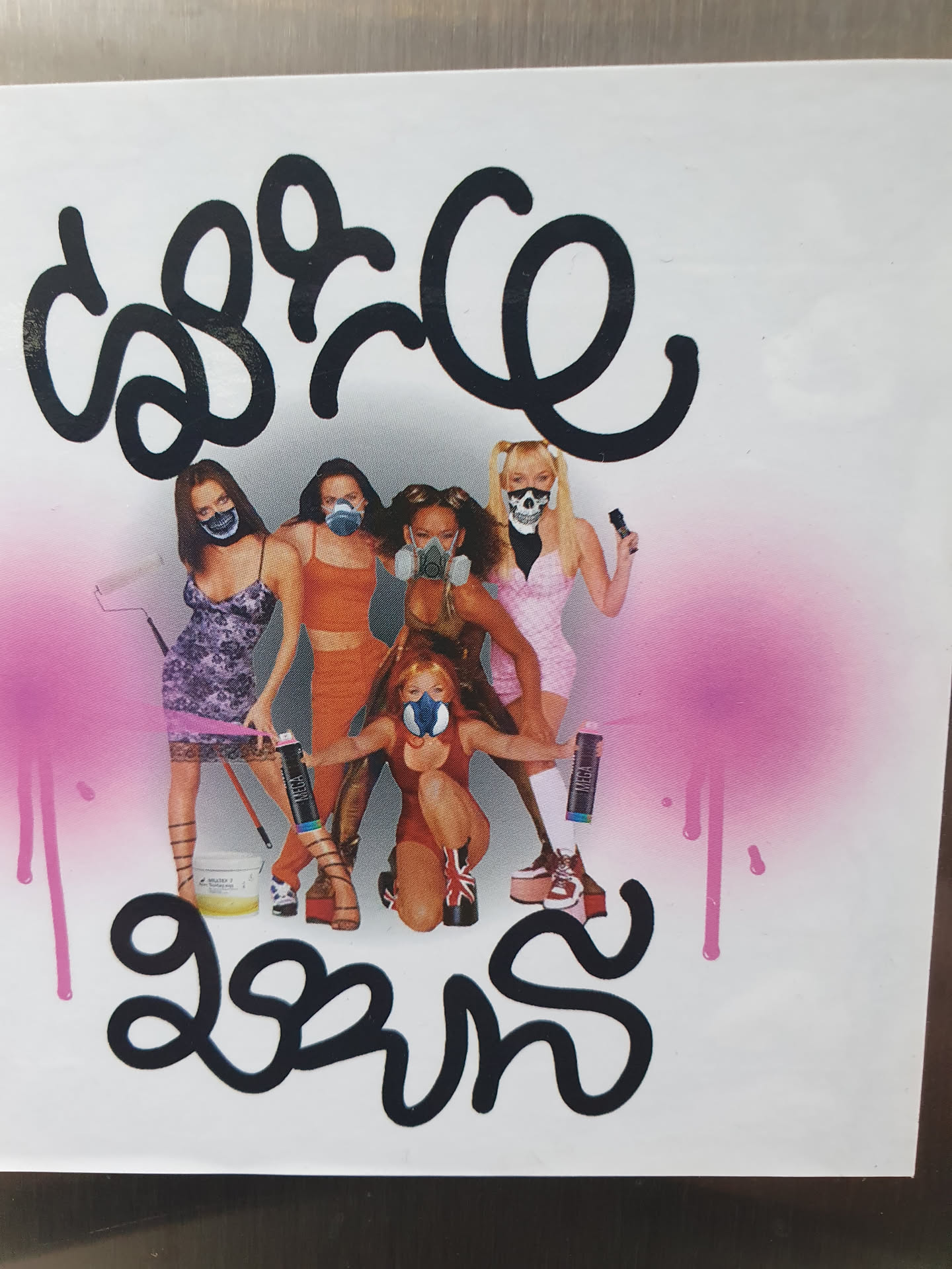 A sticker featuring the Spice Girls in graffiti style, wearing gas masks and holding spray cans. The text at the top and bottom appears to be in a stylized script.