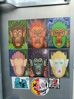 Street sticker A collection of colorful monkey stickers, each with a unique design and style. Some monkeys are on fire, others are zombie monkeys, and some are in different settings like a jungle.  The artist's signature, "KONGHAI", is visible on several stickers.