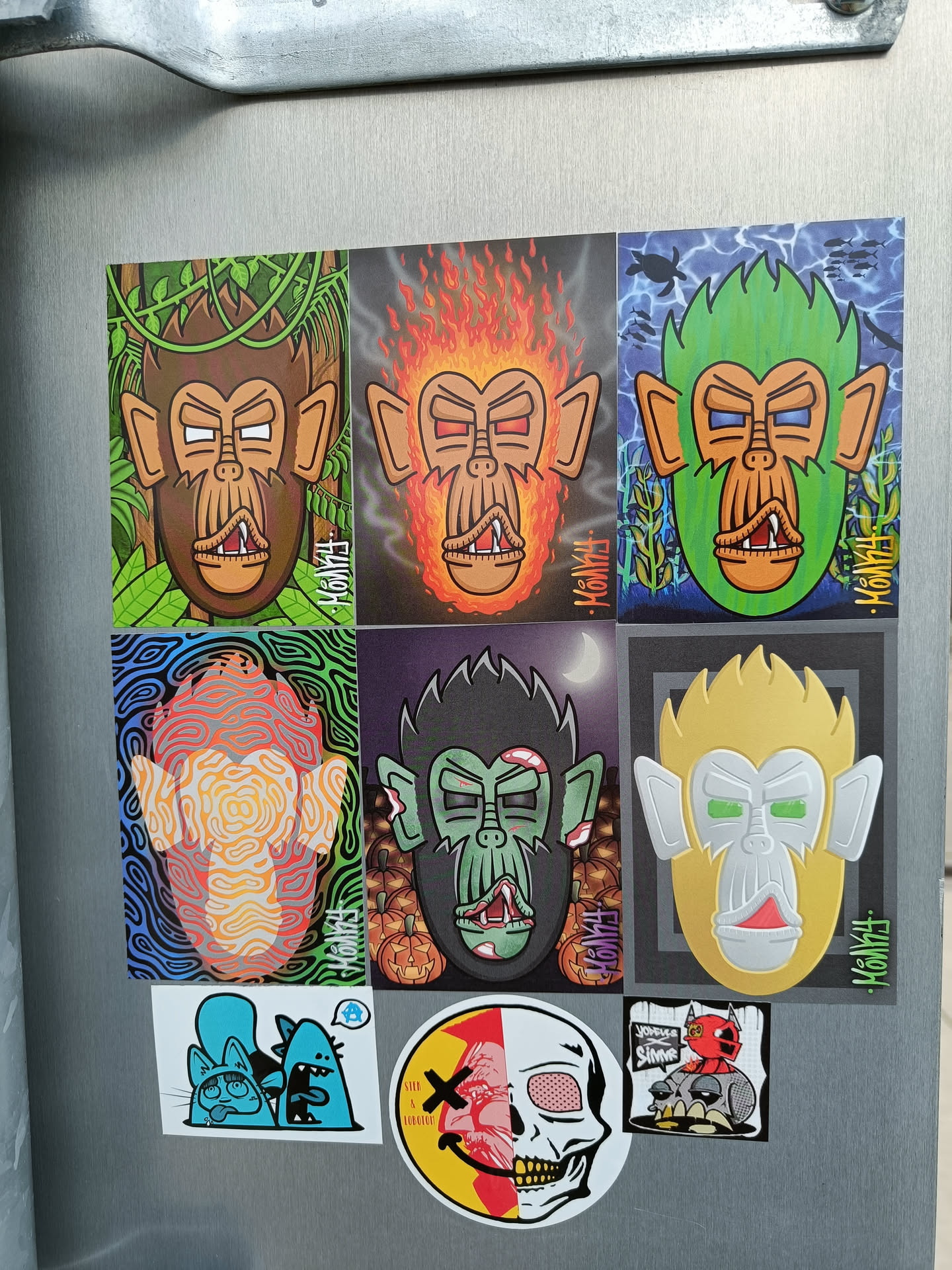 A collection of colorful monkey stickers, each with a unique design and style. Some monkeys are on fire, others are zombie monkeys, and some are in different settings like a jungle.  The artist's signature, "KONGHAI", is visible on several stickers.