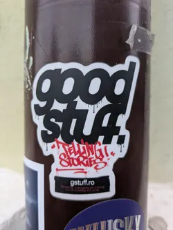 The sticker features the text "good stuff!" in a bold, dripping font, followed by "TELLING STORIES" in red graffiti style.  The website "gstuff.ro" is also prominently displayed, promising "Stories of investigating and archiving cultural knowledge and values."