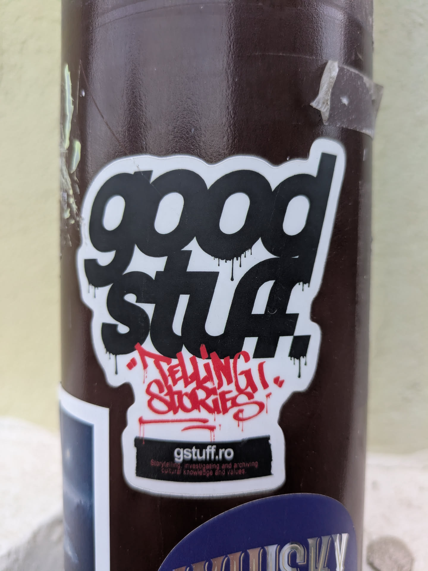 The sticker features the text "good stuff!" in a bold, dripping font, followed by "TELLING STORIES" in red graffiti style.  The website "gstuff.ro" is also prominently displayed, promising "Stories of investigating and archiving cultural knowledge and values."