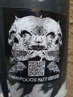 Black and white sticker with a psychedelic illustration of two skulls with a third eye in the middle, holding a pizza slice.  There is a QR code at the bottom with the text 'Order your pizza online!'