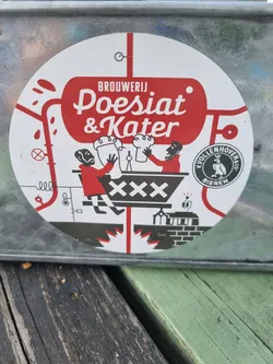 Street sticker A round sticker showcasing the logo of Brouwerij Poesiat & Kater brewery.  The design is primarily red and white, depicting a stylized brewery scene with two figures operating machinery. The brewery's name is prominently displayed, along with additional text that may refer to their location or a slogan. A small circular logo with a bird is also visible.