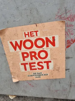 Street sticker A sticker announcing a housing protest at De Dam in Amsterdam on September 12, 2021 at 2 PM.