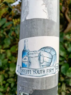 A sticker depicting a bottle of what seems to be Pomerania, a beer mug, and a ball, with the text "PFEFFI YOUTH FIRM" on a banner. The style is hand-drawn, in shades of blue.