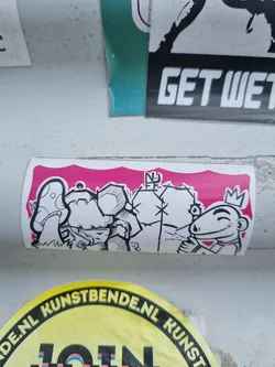 Street sticker This sticker shows a cartoon-like illustration of two characters on a pink background. One character wears a crown and has a sly expression, while the other has a mushroom-like appearance. The style is reminiscent of graffiti art. 