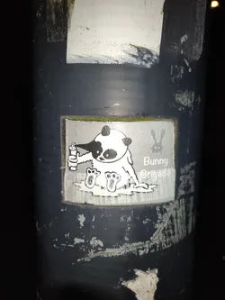 A sticker featuring a panda character from the Bunny Brigade, seemingly enjoying a drink. The art style is simple and cute, with a black and white color scheme.
