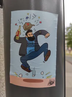 This sticker features a dynamic illustration of a bearded man in motion, possibly mid-jump.  He's wearing a Stone Island jacket and a Jungborn Nature sweatshirt, adding a layer of streetwear aesthetic to the cartoon style. A bottle of wine is flying through the air, adding an element of surprise or action to the scene. The artist's signature, "ArtZac," is visible in the bottom right corner.