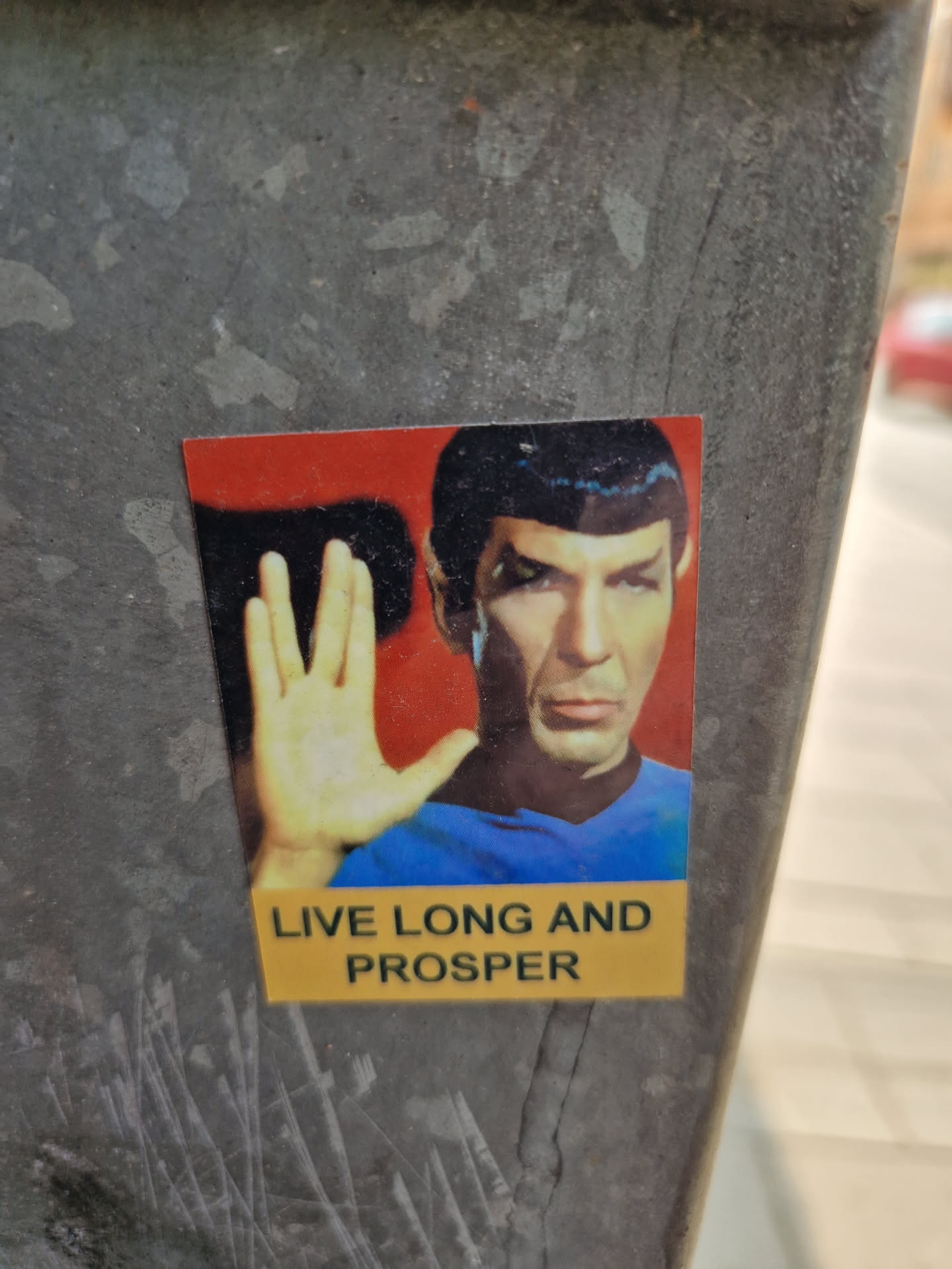 A sticker featuring Spock from Star Trek performing the Vulcan salute. The text 'Live long and prosper' is displayed below the image.