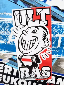 A sticker featuring a cartoon face with a wide smile and the text "ULT RAS" in bold letters. The colors are predominantly black, red, and white.  There is smaller text at the bottom that reads "Schwabensturm".