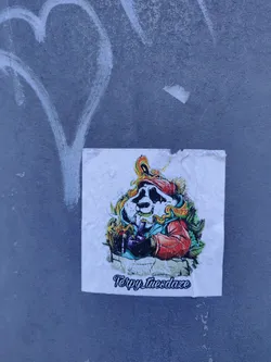 A sticker featuring a cartoon panda smoking a bong. The panda is wearing a red jacket and has flames around its head. The text at the bottom reads "Terpy Tuesday".