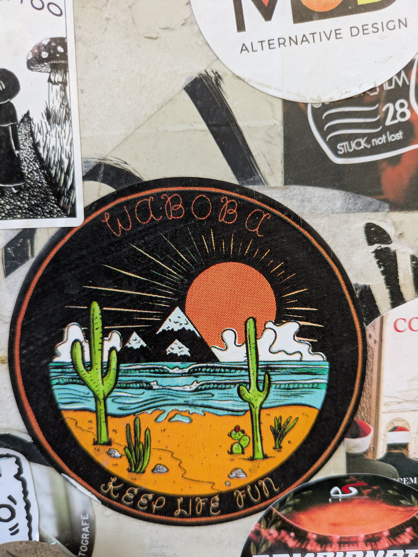A round Waboba sticker featuring a desert landscape with cacti, mountains, and a setting sun. The text 'WABOBA' is at the top and 'KEEP LIFE FUN' is at the bottom of the sticker.