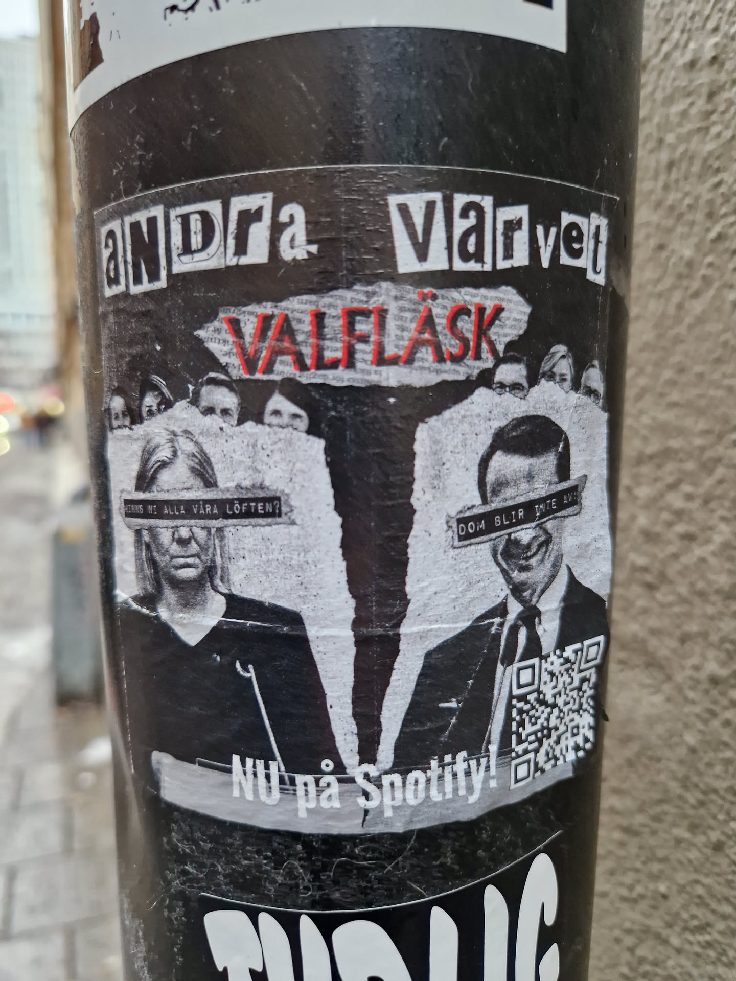 A black and white sticker featuring a collage of faces and text. The text at the top reads "Andra Värvet" and in the middle it says "Valfläsk". At the bottom it says "Nu på Spotify!" and includes a QR code. 