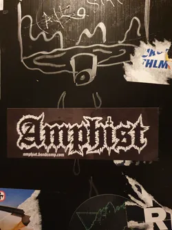 Black and white sticker with the band name Amphist in a stylized font.  The bandcamp link is also present at the bottom. 