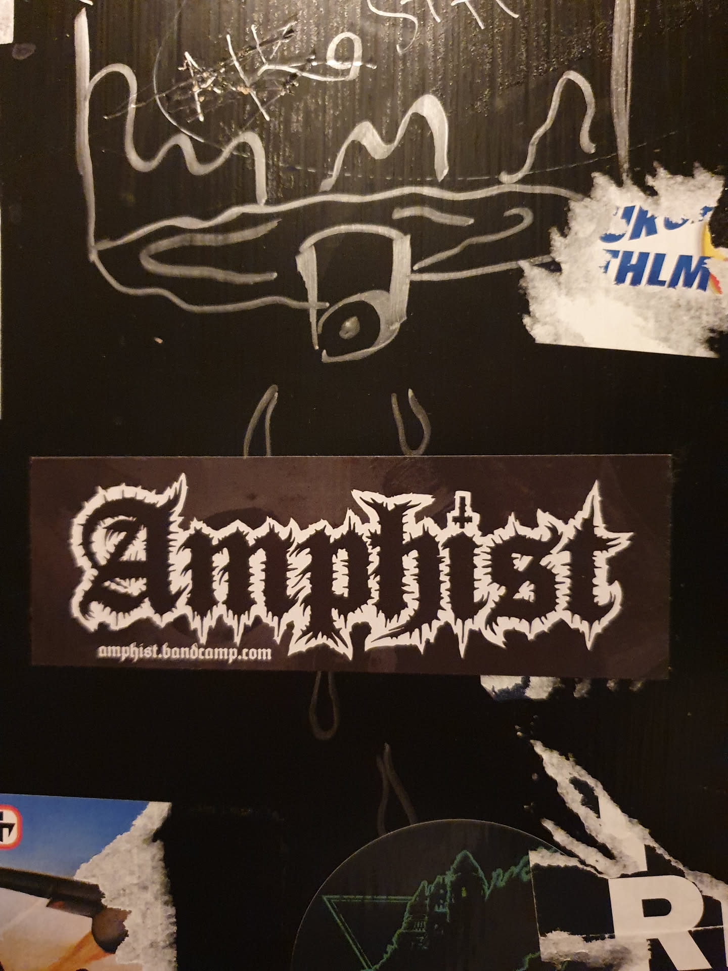 Black and white sticker with the band name Amphist in a stylized font.  The bandcamp link is also present at the bottom. 