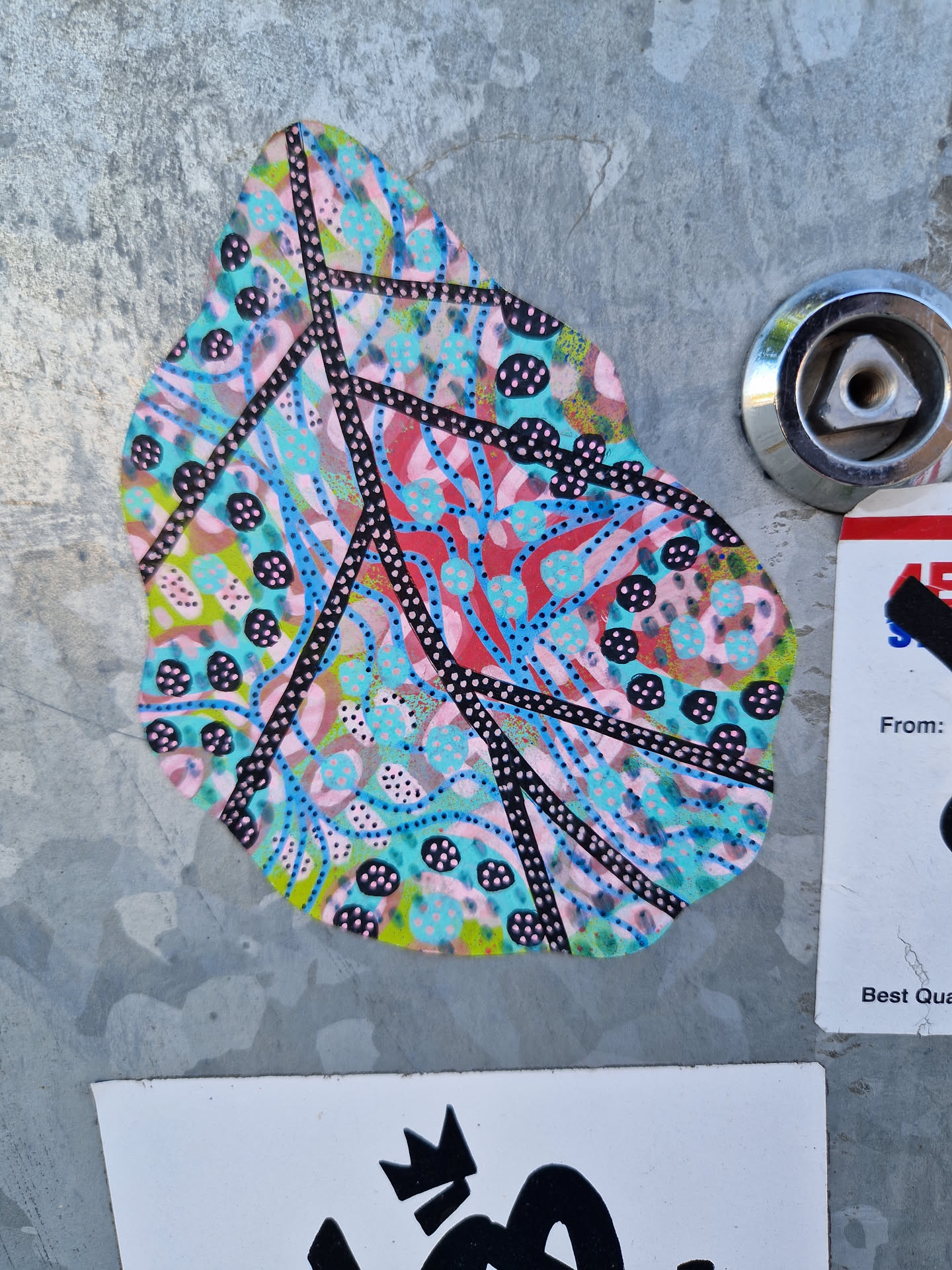 This sticker features an abstract design resembling a leaf.  It's predominantly pink, teal, and black, with various patterns and dots. The lines and shapes create a visually interesting and organic feel.