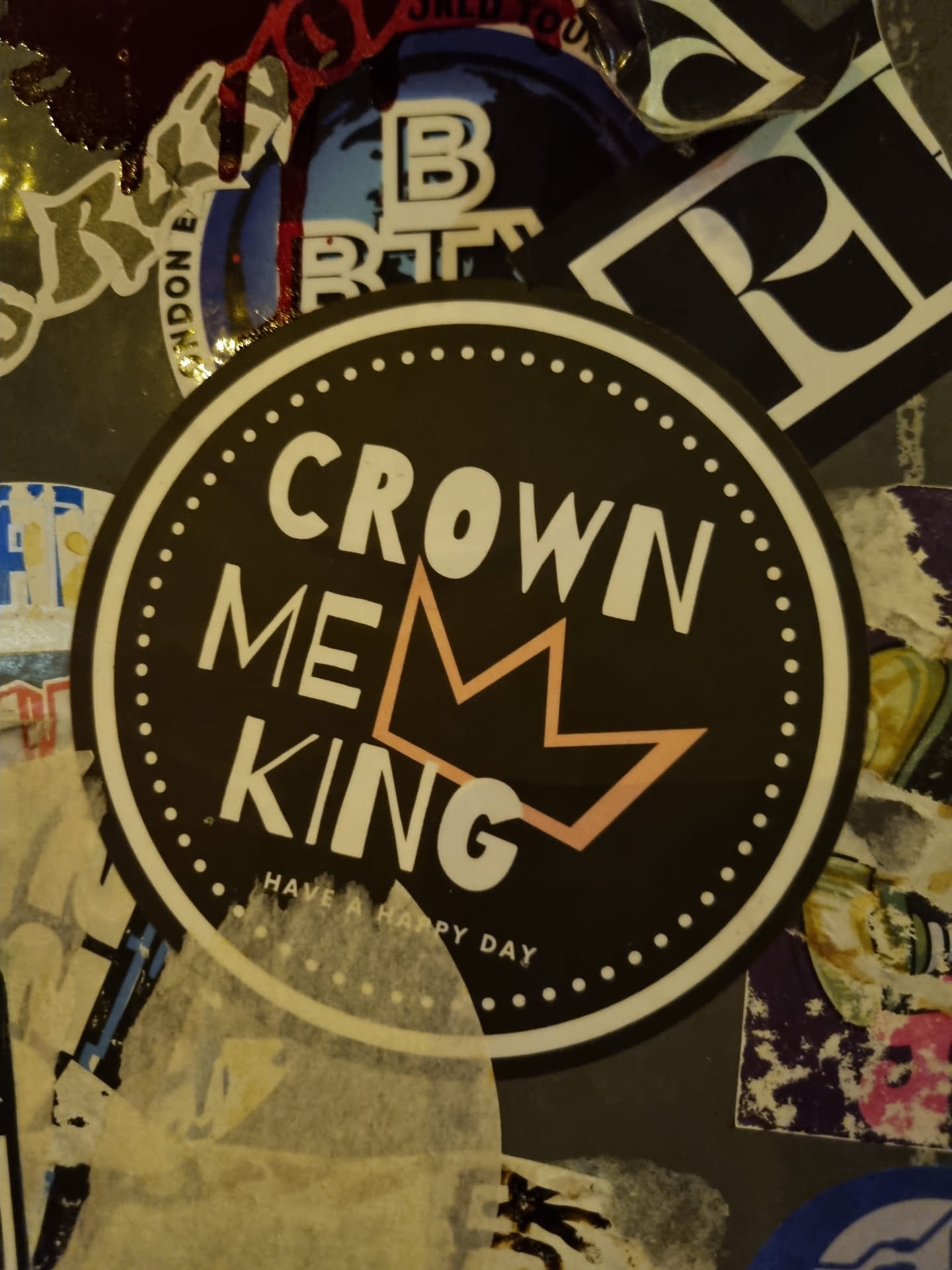 Round black and white sticker with the text CROWN ME KING and a crown graphic.  The text "HAVE A HAPPY DAY" is written at the bottom. 