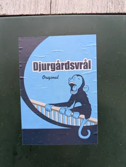 This sticker features a blue cartoon monkey yelling while holding on to a rail. The text "Djurgårdsvrål" and "Original" are printed above the monkey.