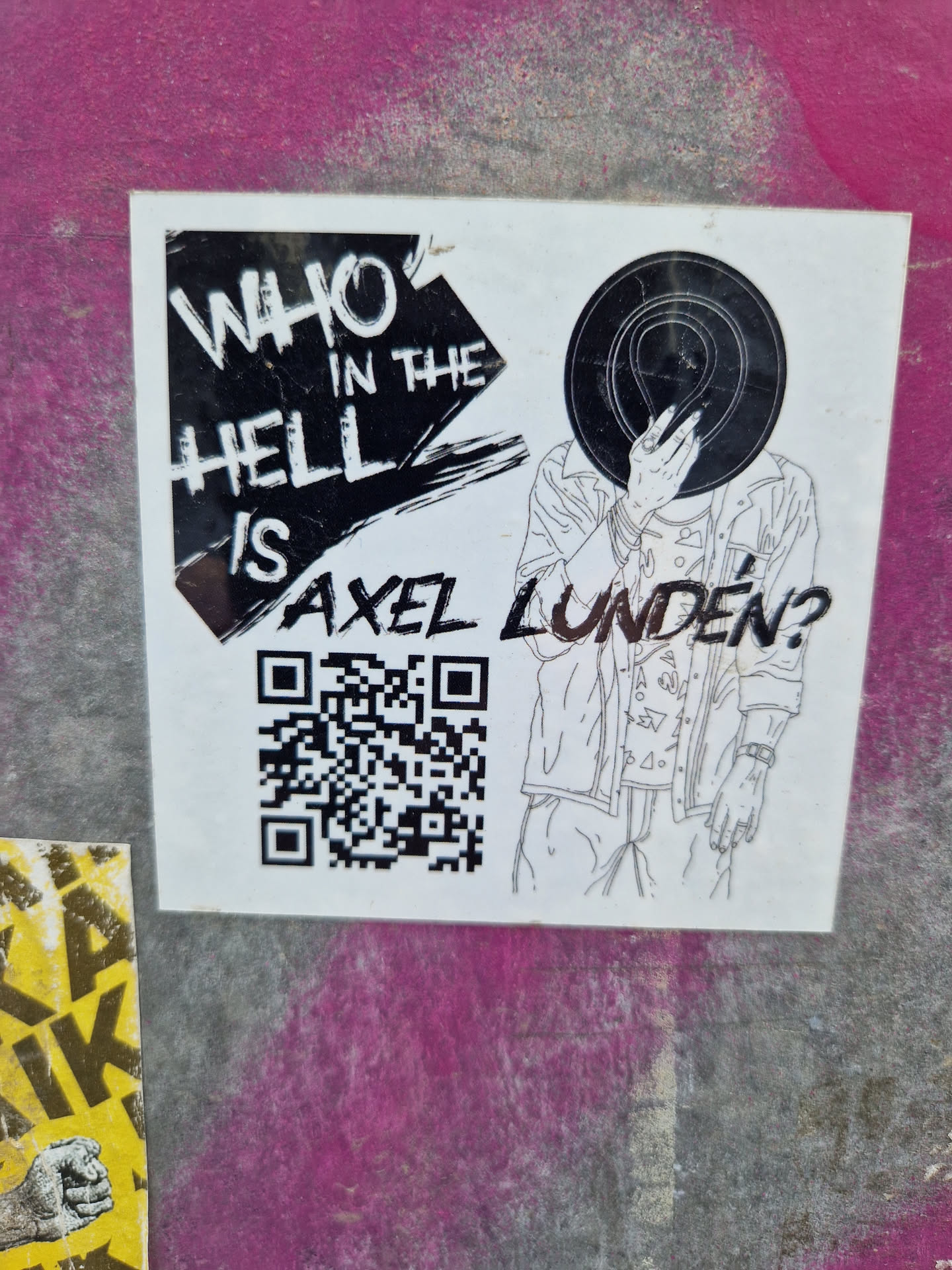 Black and white sticker featuring a stylized illustration of a person with a record covering their face. Text on the sticker reads: "Who in the Hell is Axel Lunden?" and includes a QR code.