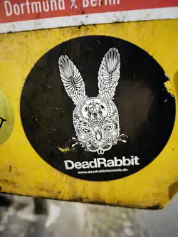 A round black and white sticker featuring an ornate rabbit design.  The text 'DeadRabbit' and a website address are visible.