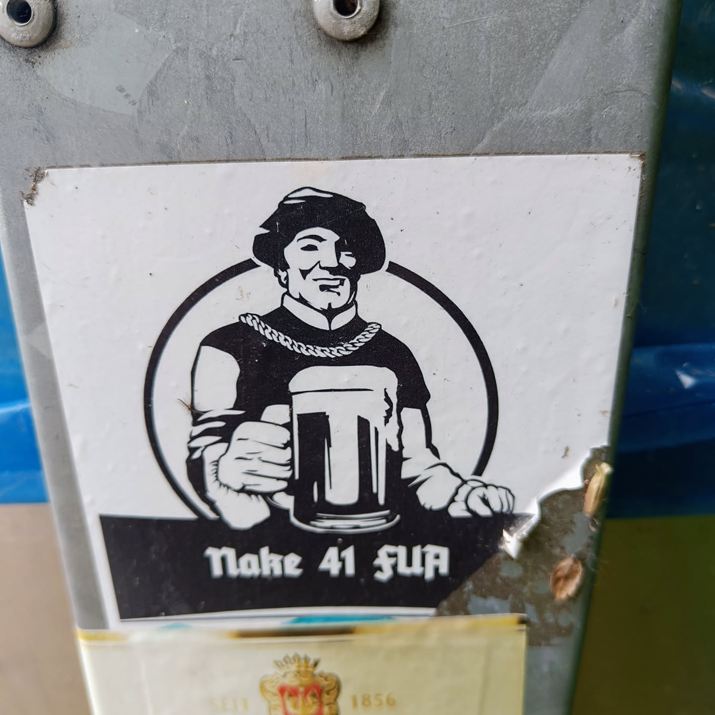 Black and white sticker of a man in medieval clothing holding a beer mug. The text below says "Make 41 fun".